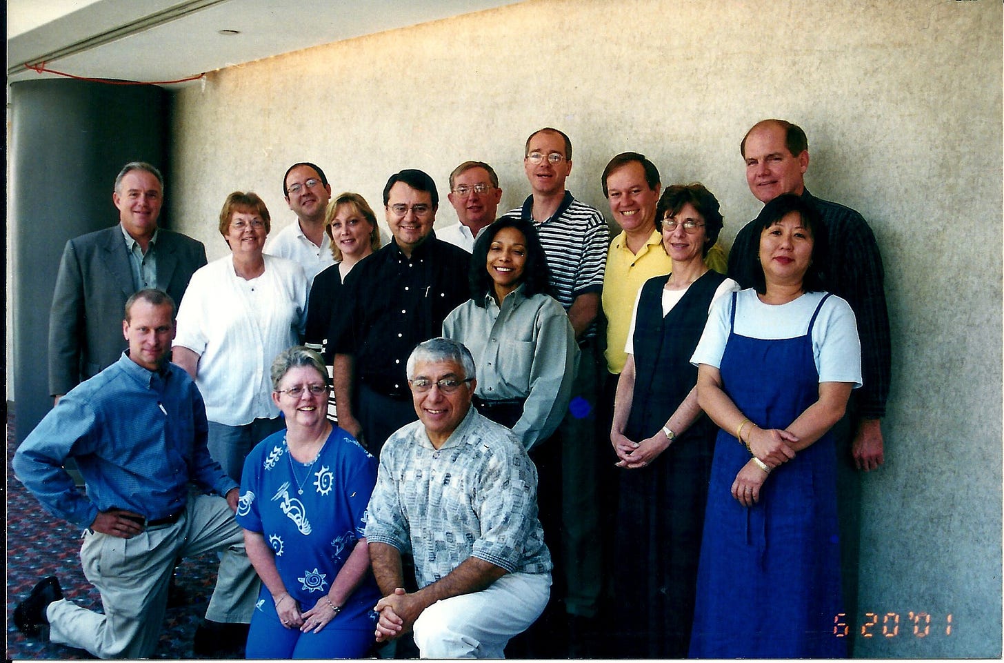 Group photo of business people posing to mark their attendance at a conference