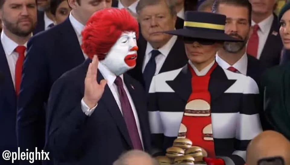 Photo of trump getting sworn in with Melania beside him. He is wearing Ronald McDonald makeup and wig, and she is dressed like the hamburger with that stupid fucking ugly hat. There is a plate of cheeseburgers between them.