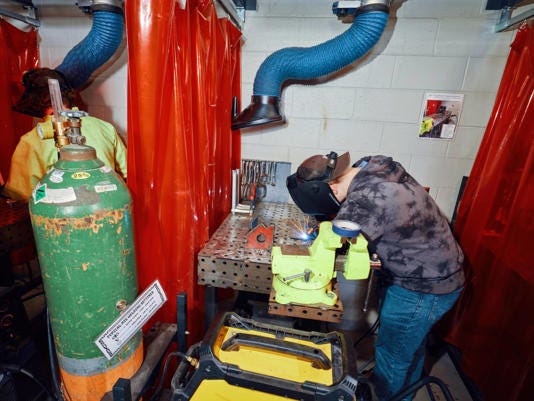 A welding student working at Middleton High School.