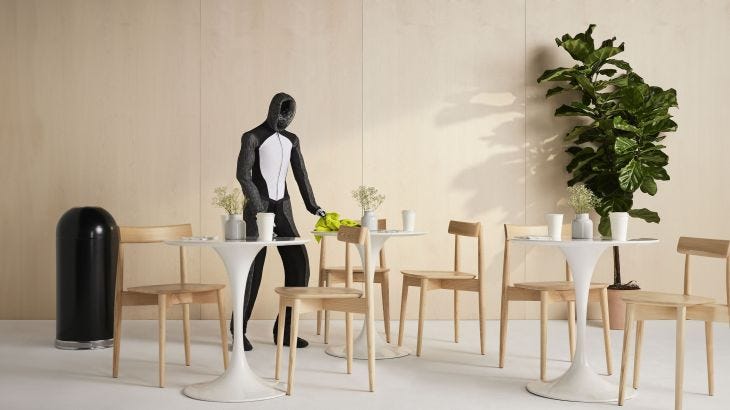1X humanoid robot neo sets table