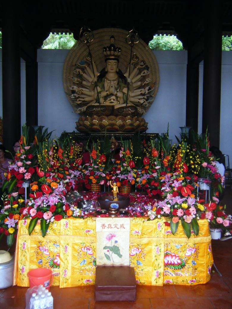 100 armed Kuan Yin with baby buddha