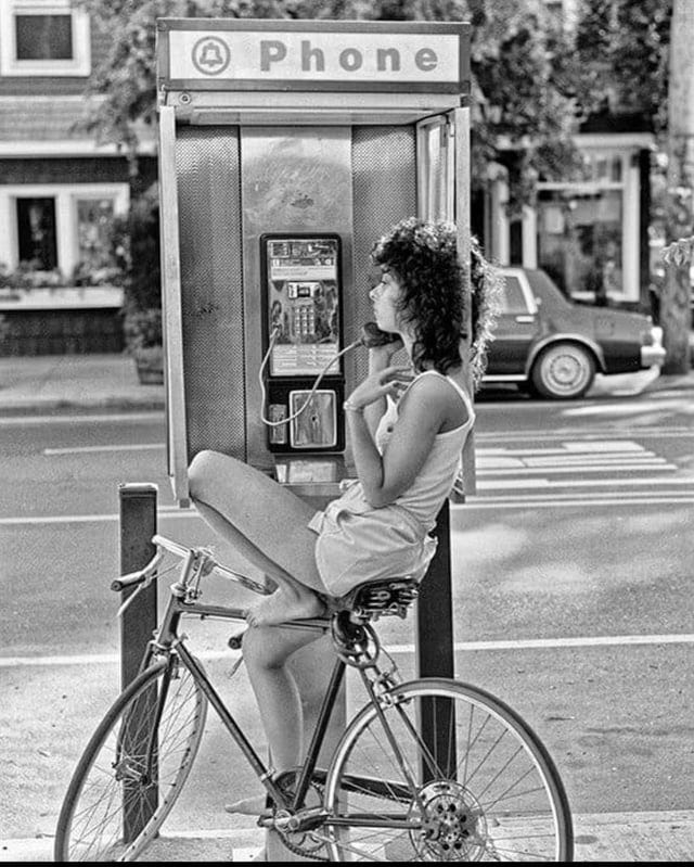 r/OldSchoolCool - Diane on the pay phone. 1980's. City Island. The Bronx, New York. Photo by Ron Terner.