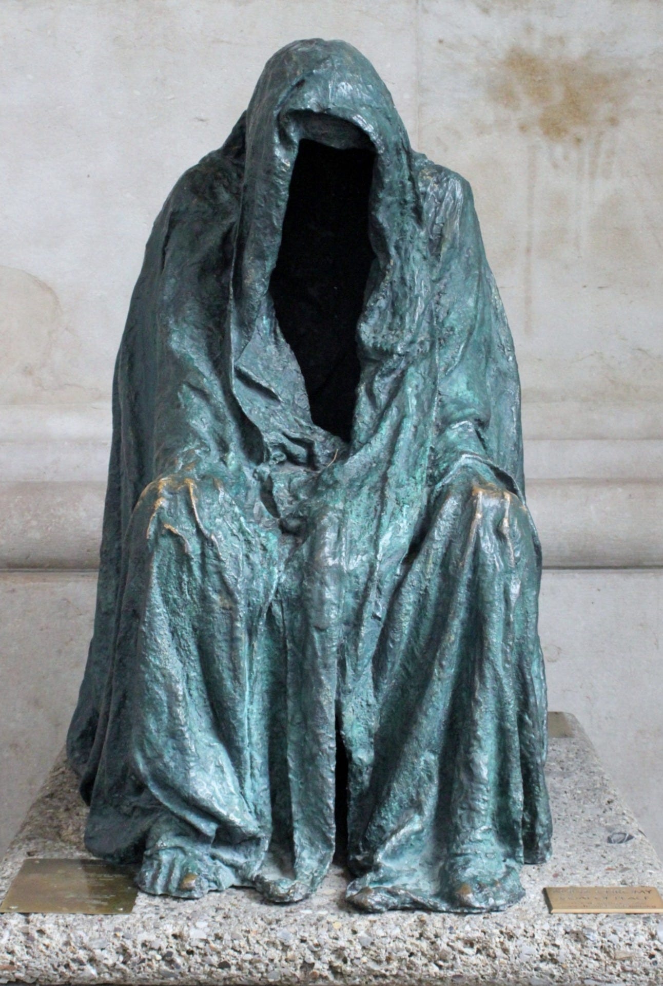 Sculpture of a hooded figure