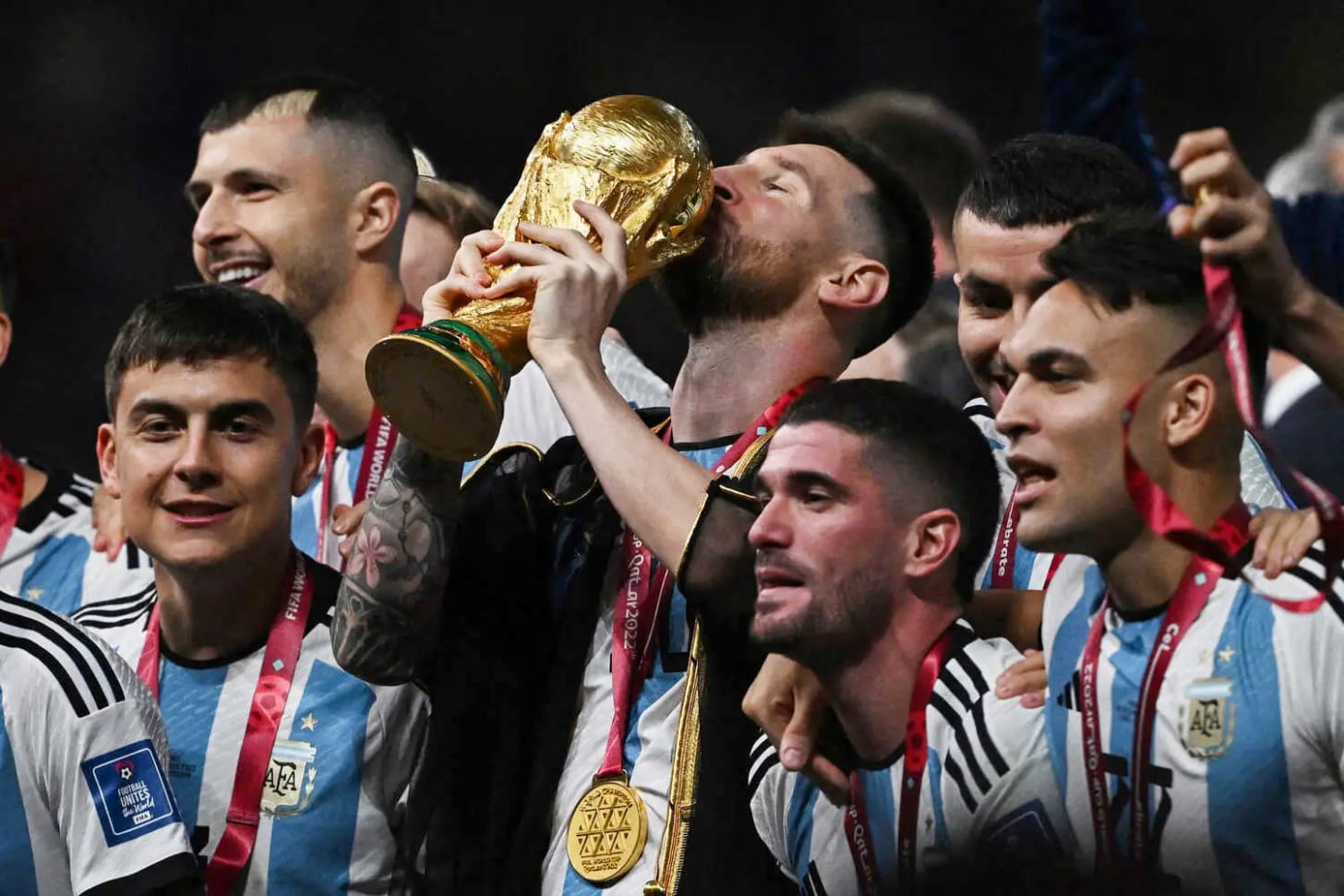 Argentina’s Lionel Messi kissed the World Cup trophy as he and his teammates celebrated their victory against France on Sunday in the final.
