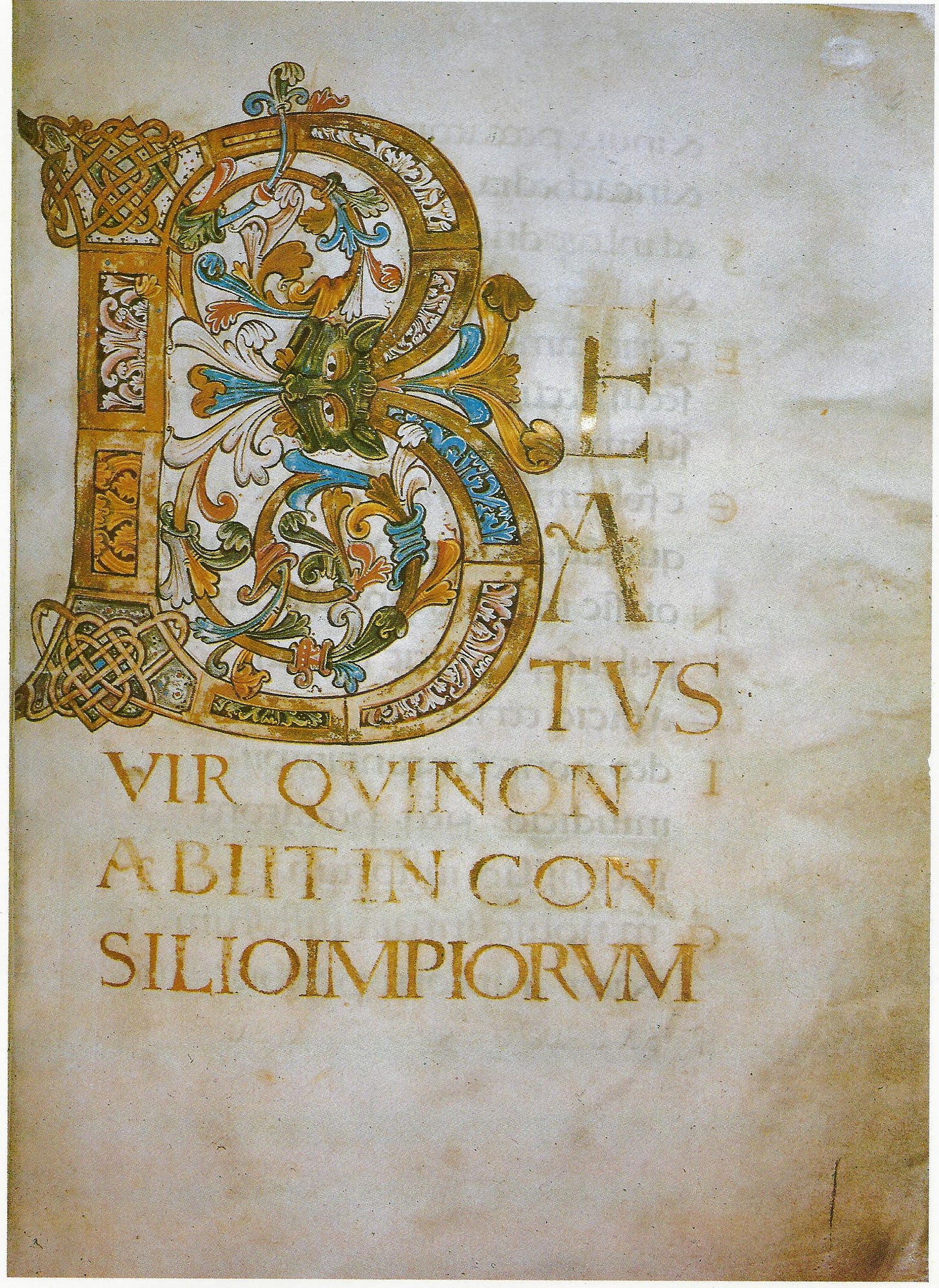 A richly illuminated page containing the first few words of Psalm 1 in Latin