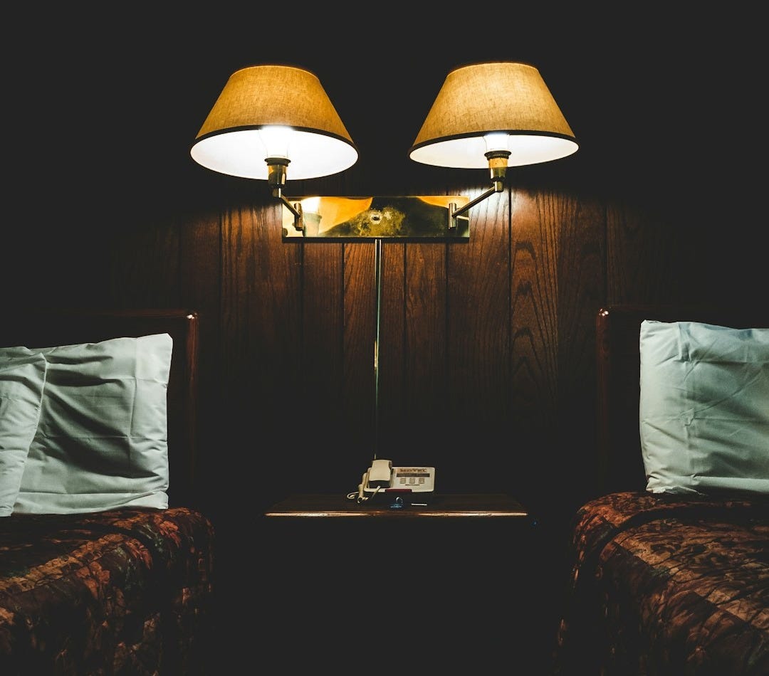 wall lamp in between of beds wall lamp in between of beds