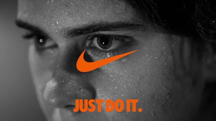 This may contain: a man's face with the nike logo painted on it