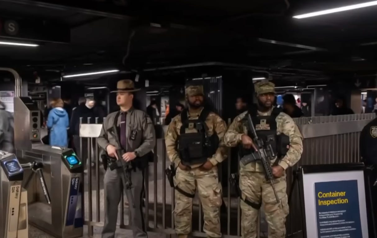 National guard members carrying large guns in NYC subway