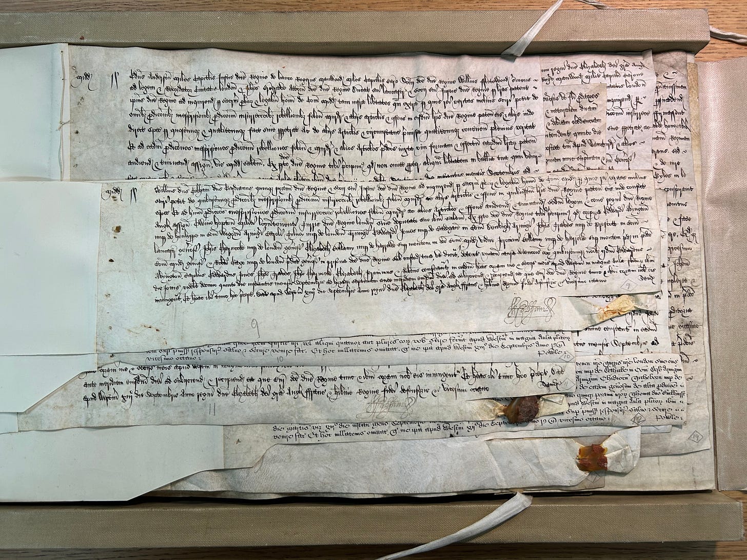 Sixteenth Century documents relating to the Babington Plot, a series of different sized parchments, some with wax seals attached.