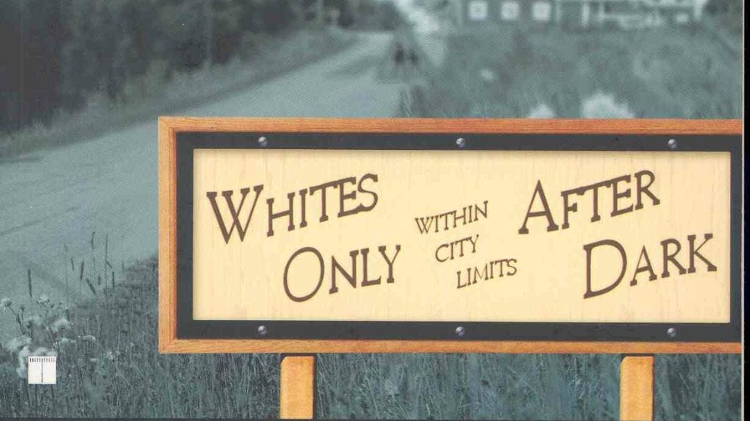 An illustration of a sign outside a ‘sundown town.’ focus of next Conversations on Race and Policing