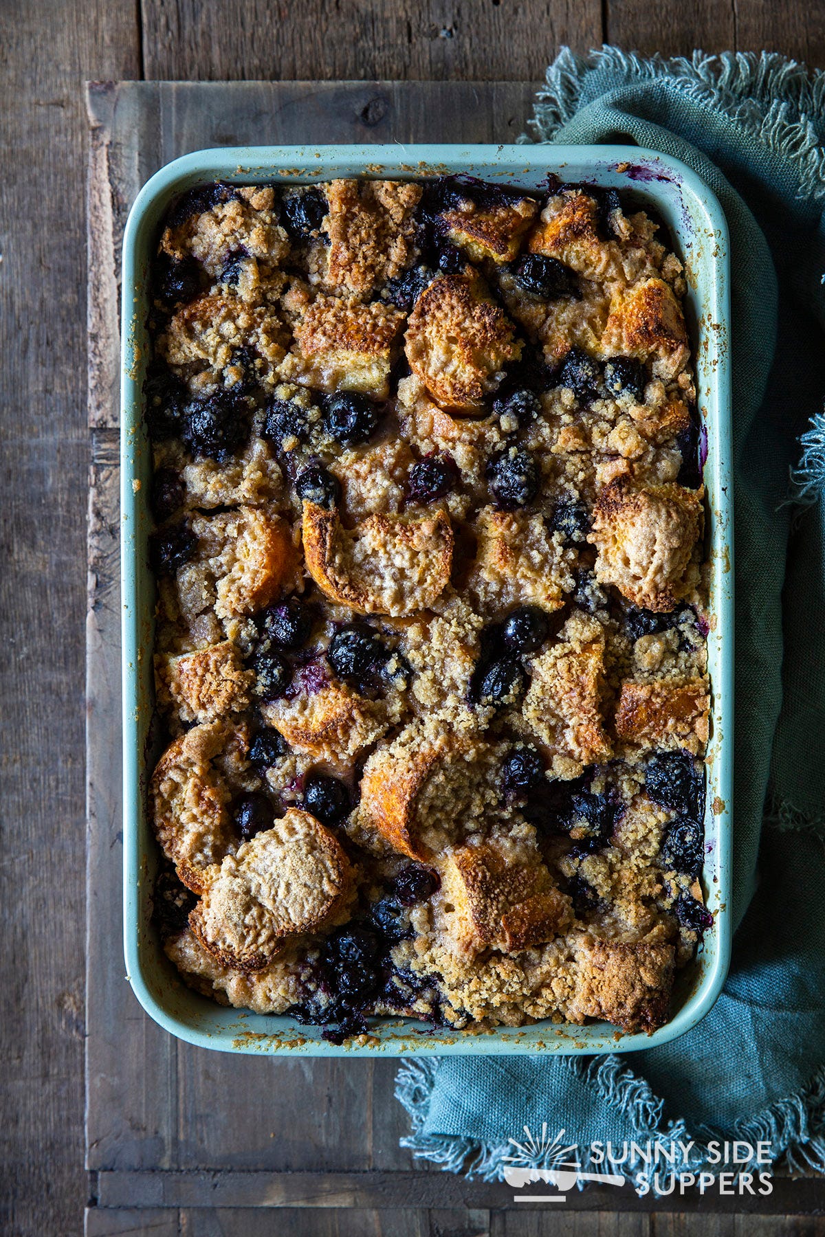 A blueberry french toast casserole in a baking dish.