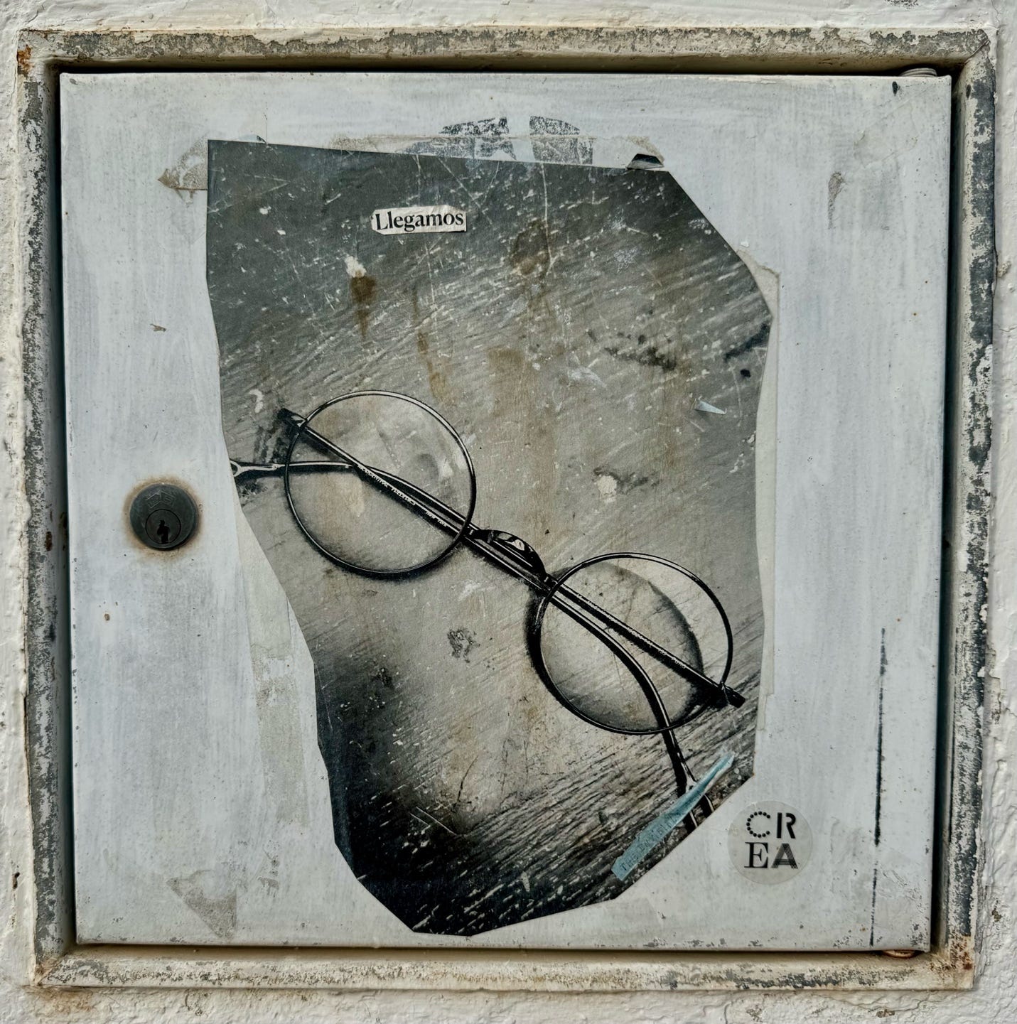 A hole in a wall with a pair of glasses on it

Description automatically generated