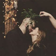 Image result for kissing under the mistletoe