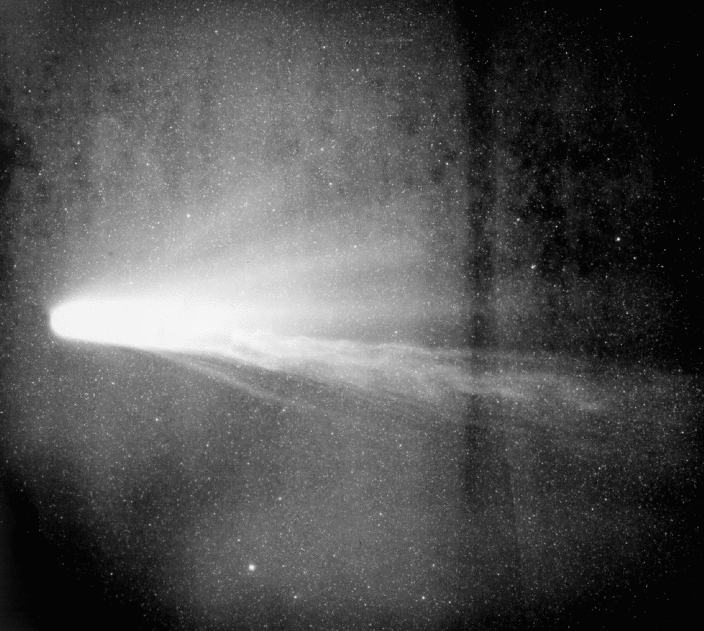 black and white photo of Halley's Comet during a disconnection event, which is seen with part of its tail breaking off