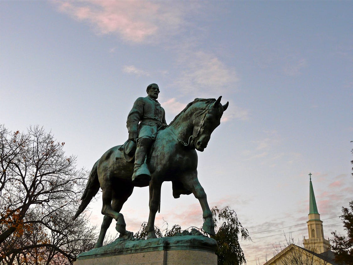 A statue of a person riding a horse

Description automatically generated