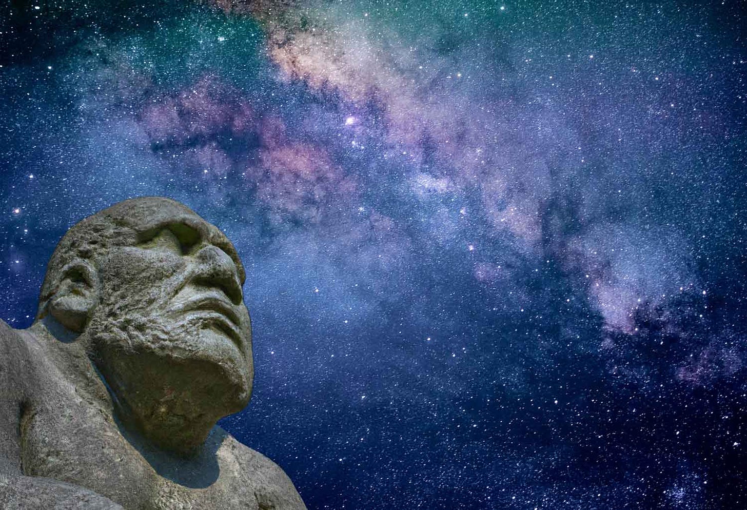 A sculpture of a caveman looking up toward a starry Milky Way