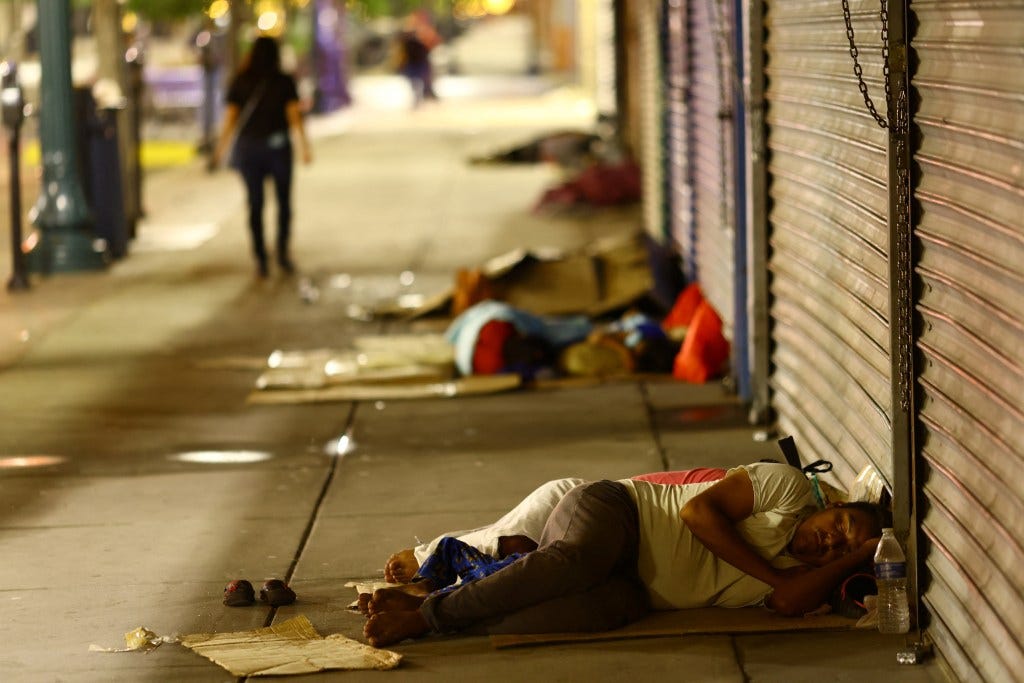 Migrants sleeping on the sidewalk in El Paso, Texas on September 12, 2023.