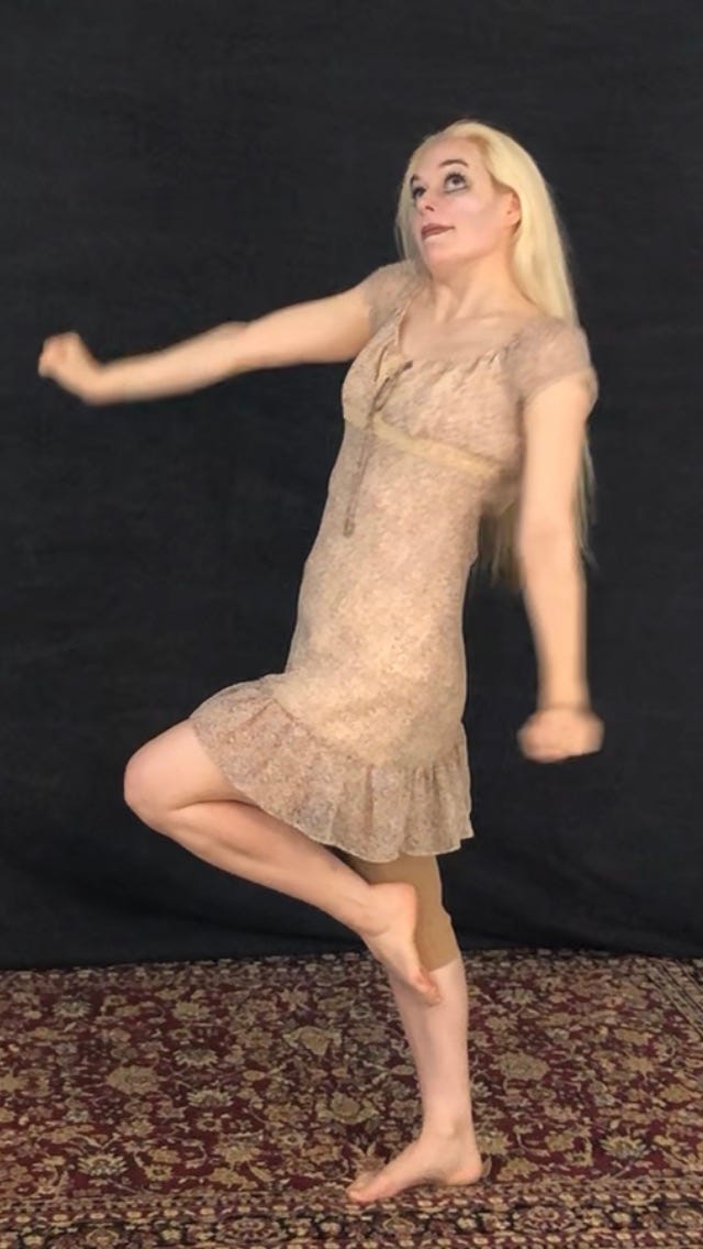 A shy blonde girl in a little flora dress
