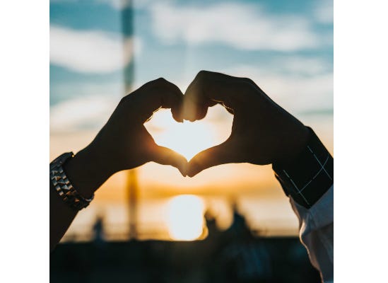 Two hands making a heart shaped image signifying you need to have courage in your relationships