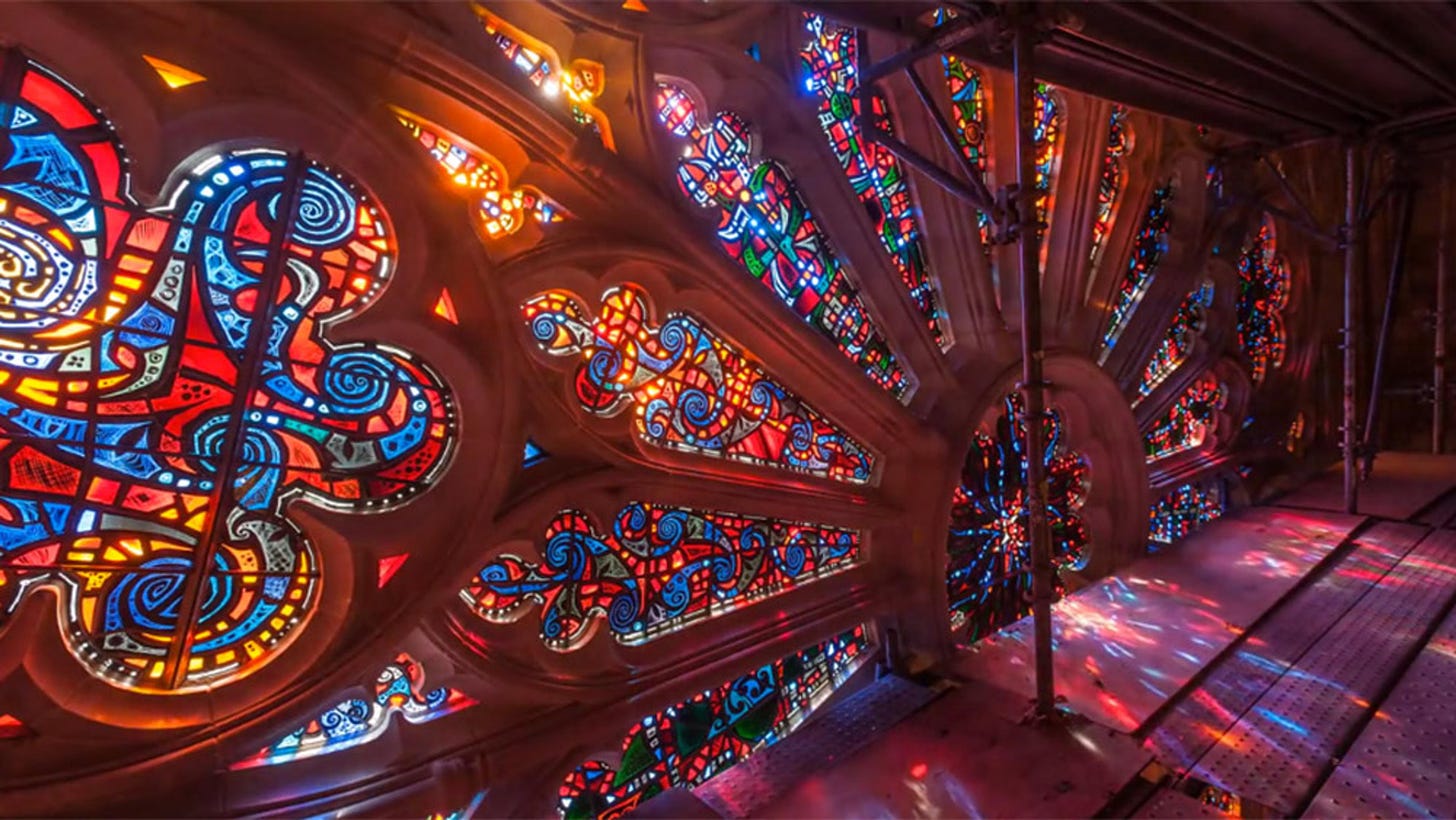 A photograph of stained glass with the light glowing through it.