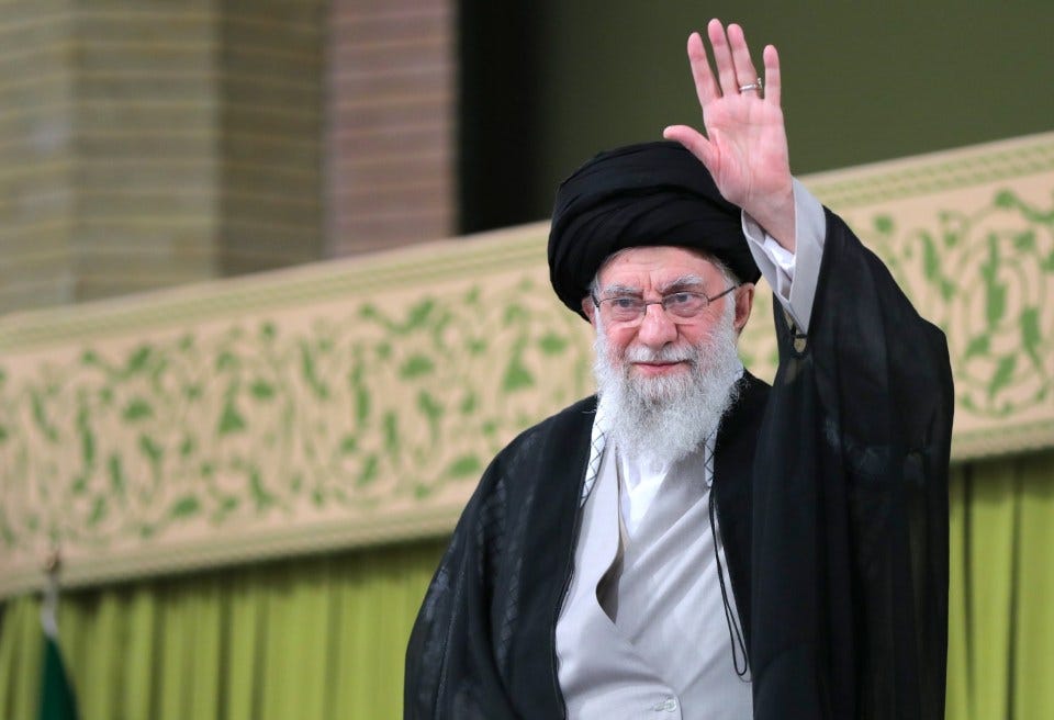 Ali Khamenei waving.