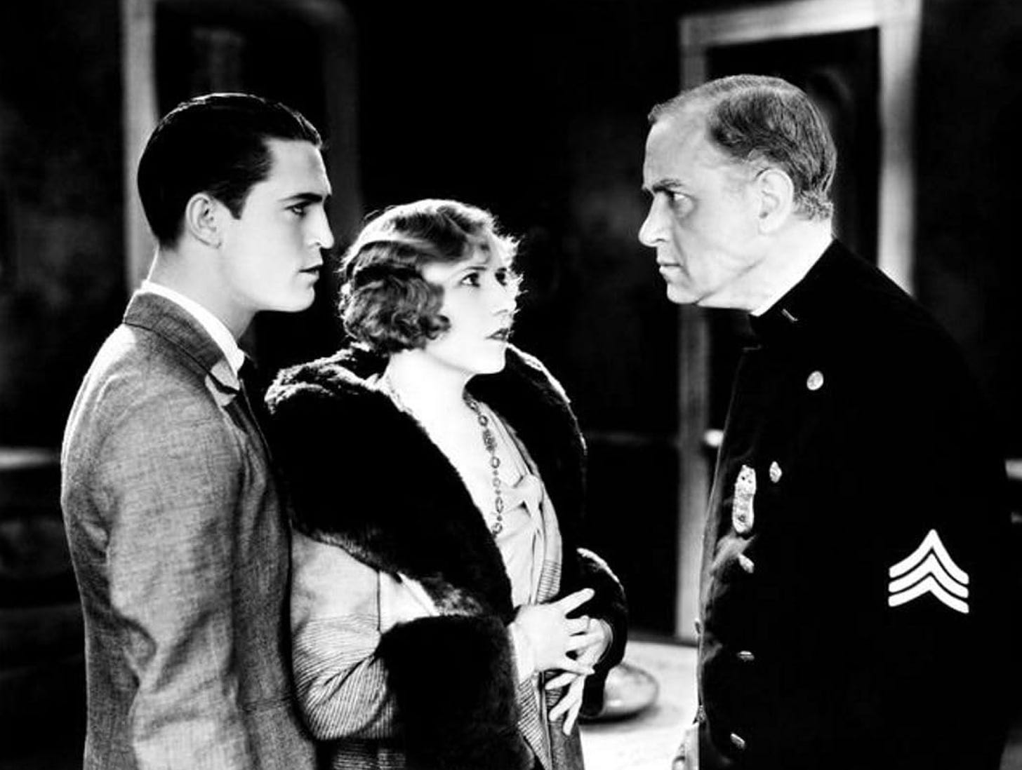 Chester Morris, Eleanor Griffith, and Purnell Pratt in a scene from Alibi