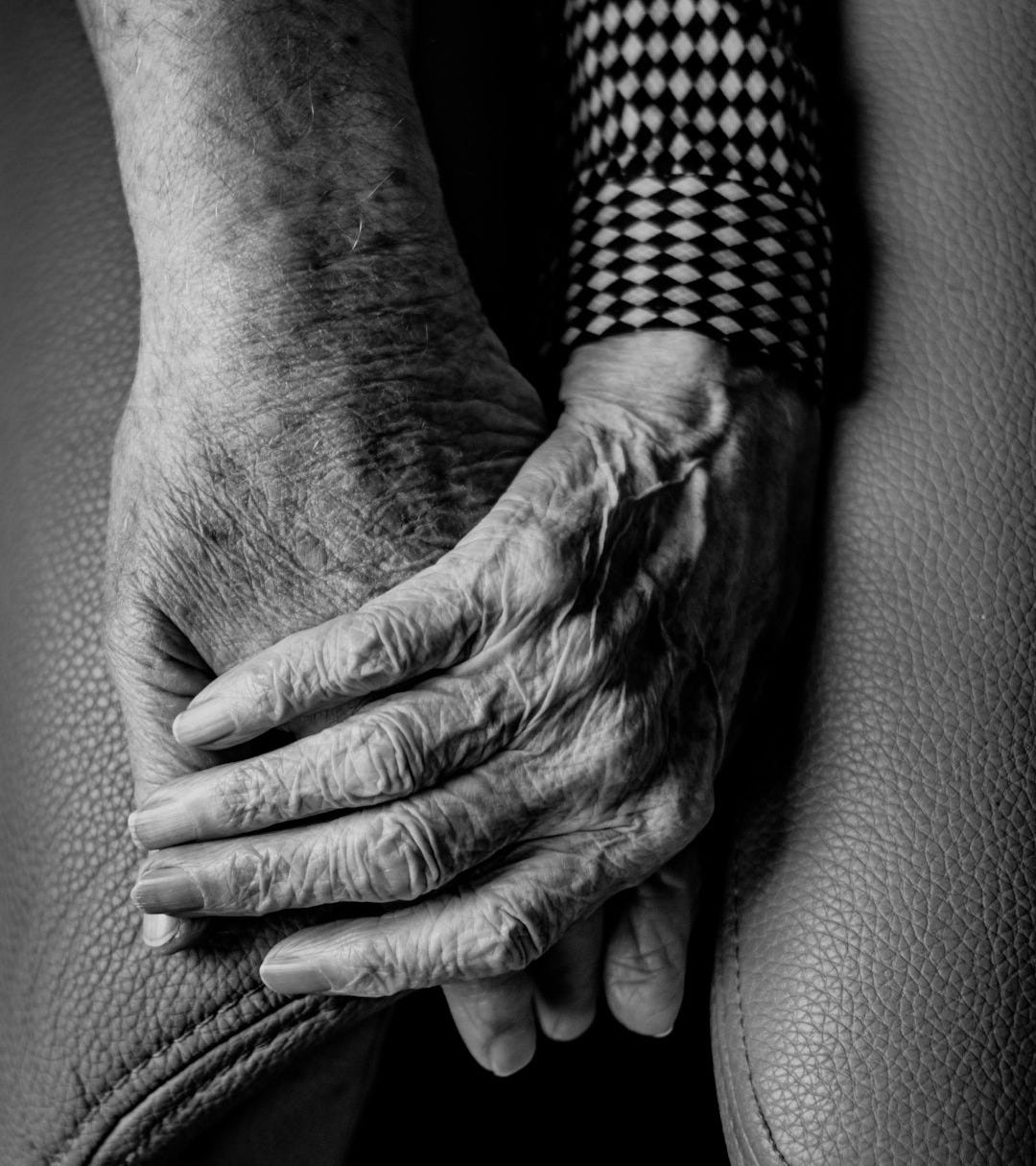 grayscale photography of human hands