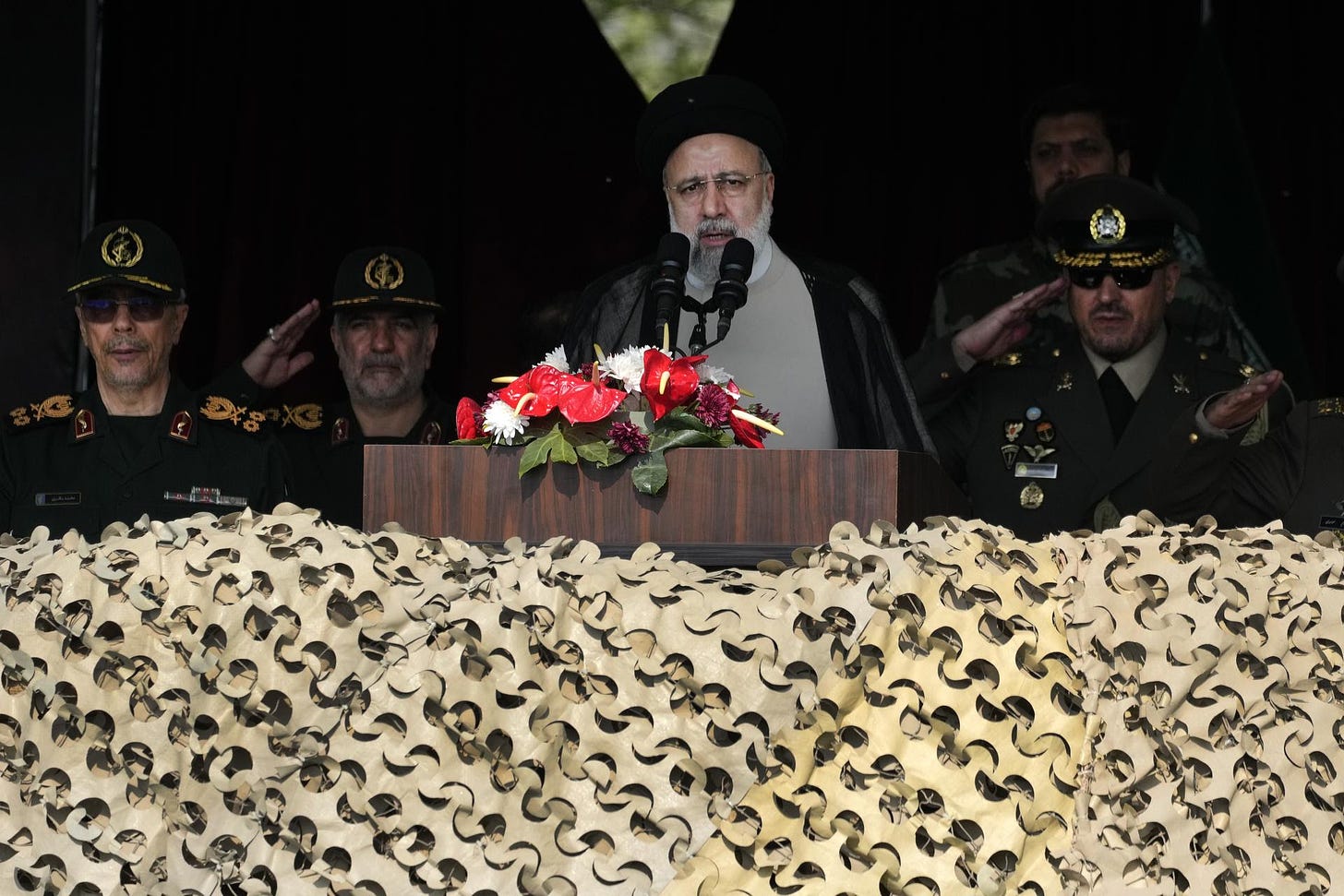 Iranian President Ebrahim Raisi speaks during an Army Day parade.