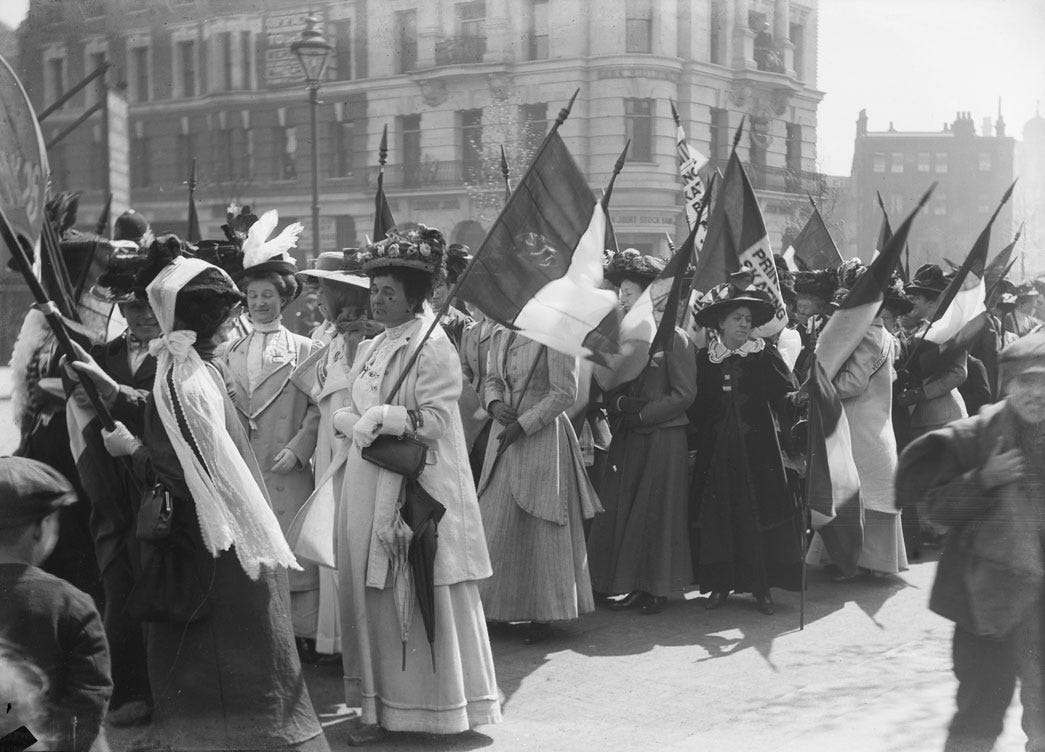 Suffragettes prepare to march in a procession to promote the Women's Exhibition, May 1909.