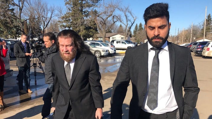 Jaskirat Singh Sidhu leaves with his lawyers Mark Brayford, right, and Glen Luther after the third day of sentencing hearings in Melfort, Sask. in 2019. 