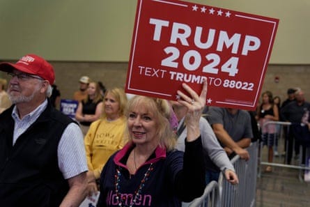 Supporters listen to Trump during the rally in Dubuque.