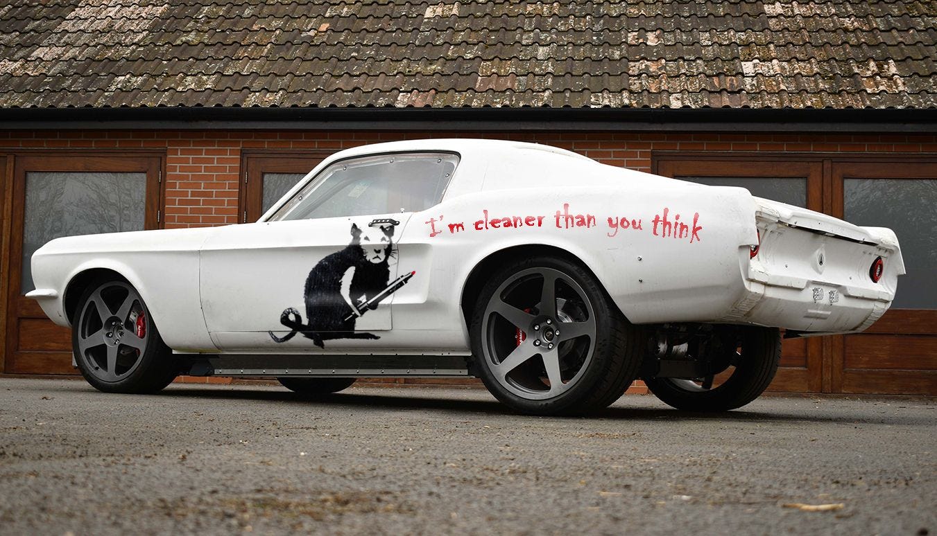 ford mustang used as ariel hipercar ev test mule with banksy-like graphics on side