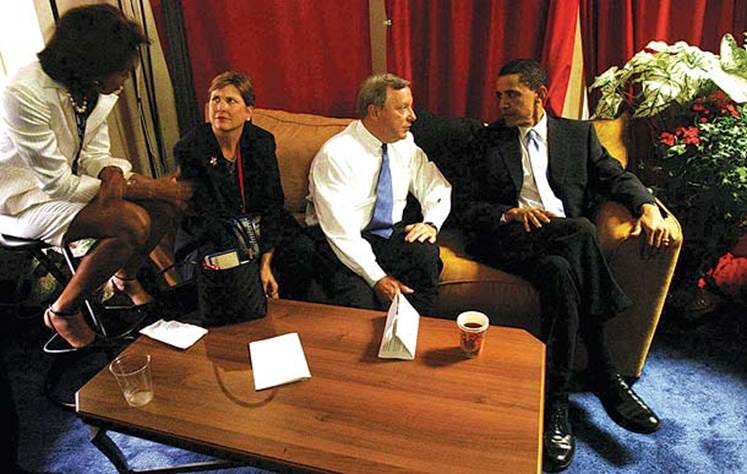 A group of people sitting on a couch

AI-generated content may be incorrect.