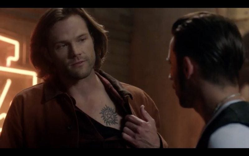 sam winchester showing tattoo off supernatural