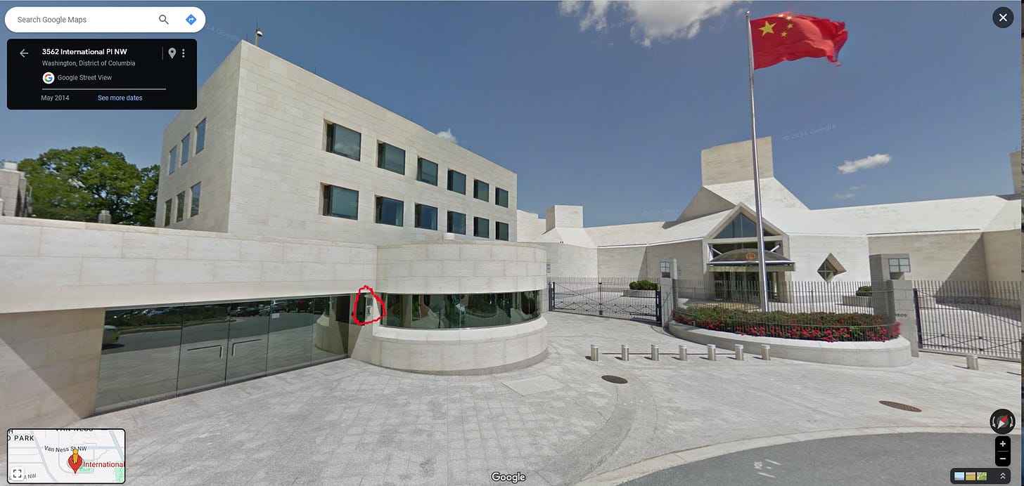 Another Google Street View image showing the front of the Chinese Embassy, the call box, and the glass doors on the left.