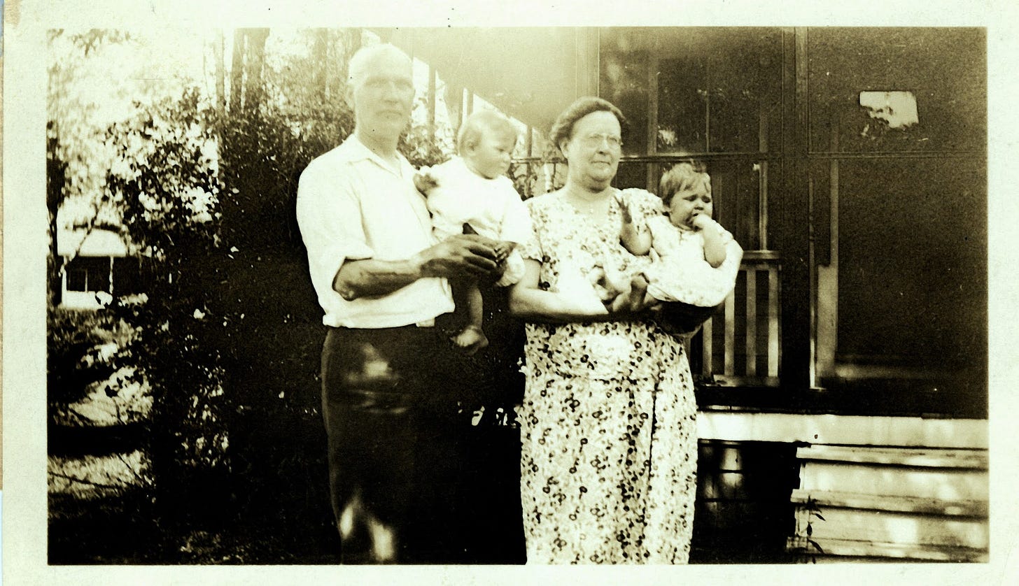 Man and woman holding children