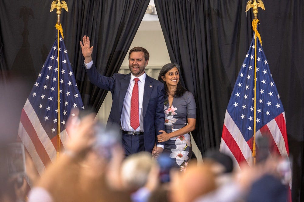 JD Vance and his wife, Usha Vance, arrive for a campaign rally in Sanford, North Carolina, on November 3