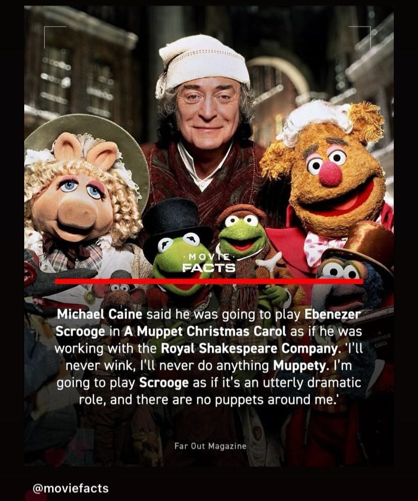 Actor Michael Caine stands with muppets Fozzie bear, Miss Piggya nd Kermit