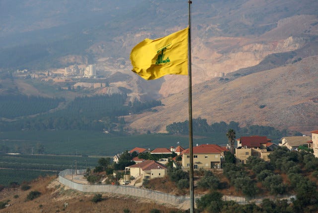 A Hezbollah flag flutters in the southern Lebanese village of Khiam, near the border with Israel, Lebanon July 28, 2020 (photo credit: REUTERS/AZIZ TAHER)