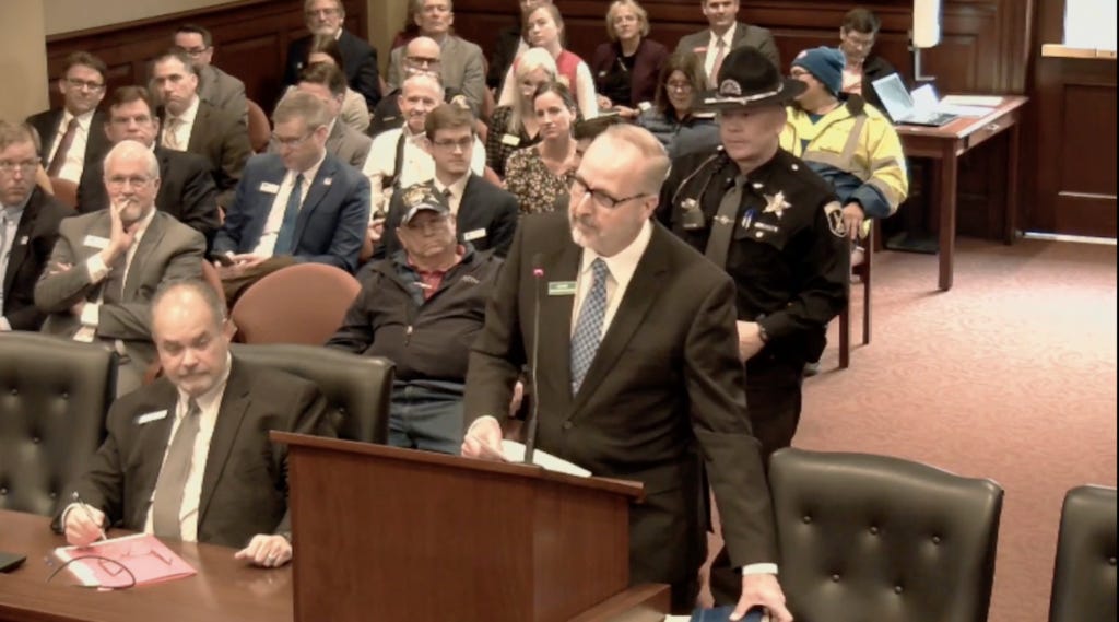 Idaho Freedom Foundation's Ron Nate and the Idaho State Police at a committee hearing