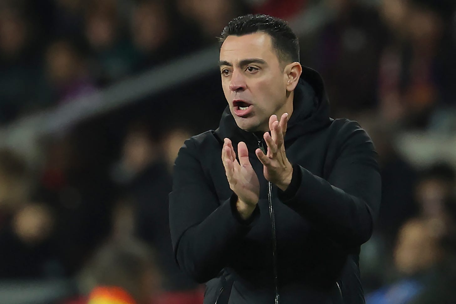 Barcelona boss Xavi pictured clapping his hands