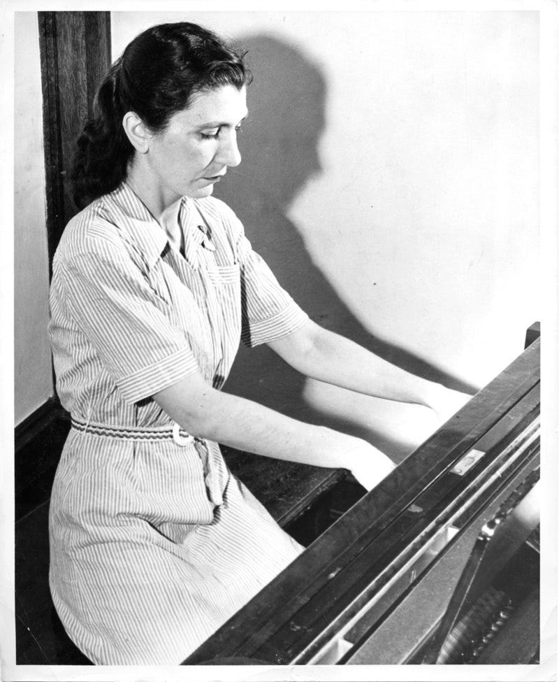 Violet Archer at the piano. Source: University of Alberta Archives