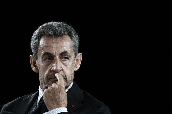 Former French President Nicolas Sarkozy attends a meeting in France.