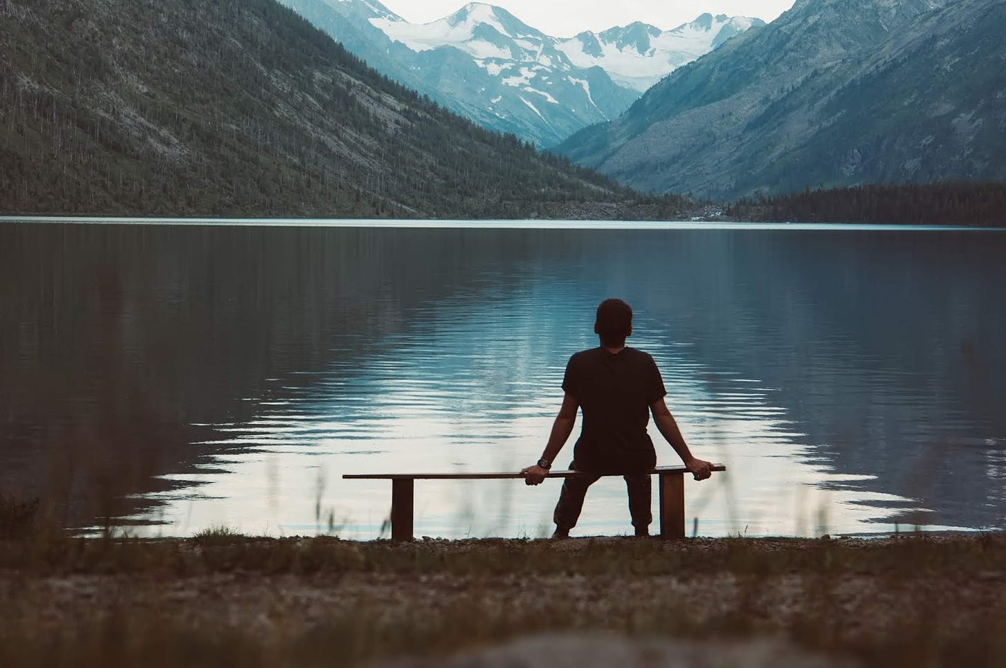 Image of a person sitting alone in a park