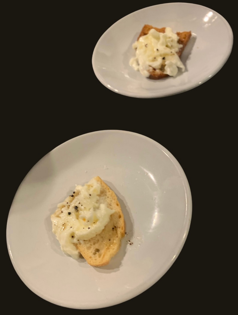 A photo of the Two small plates with the ricotta crostini