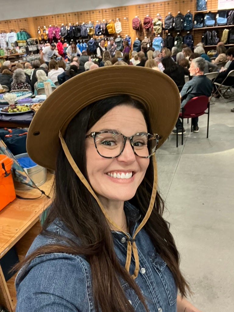 A person wearing a hat and glasses

Description automatically generated