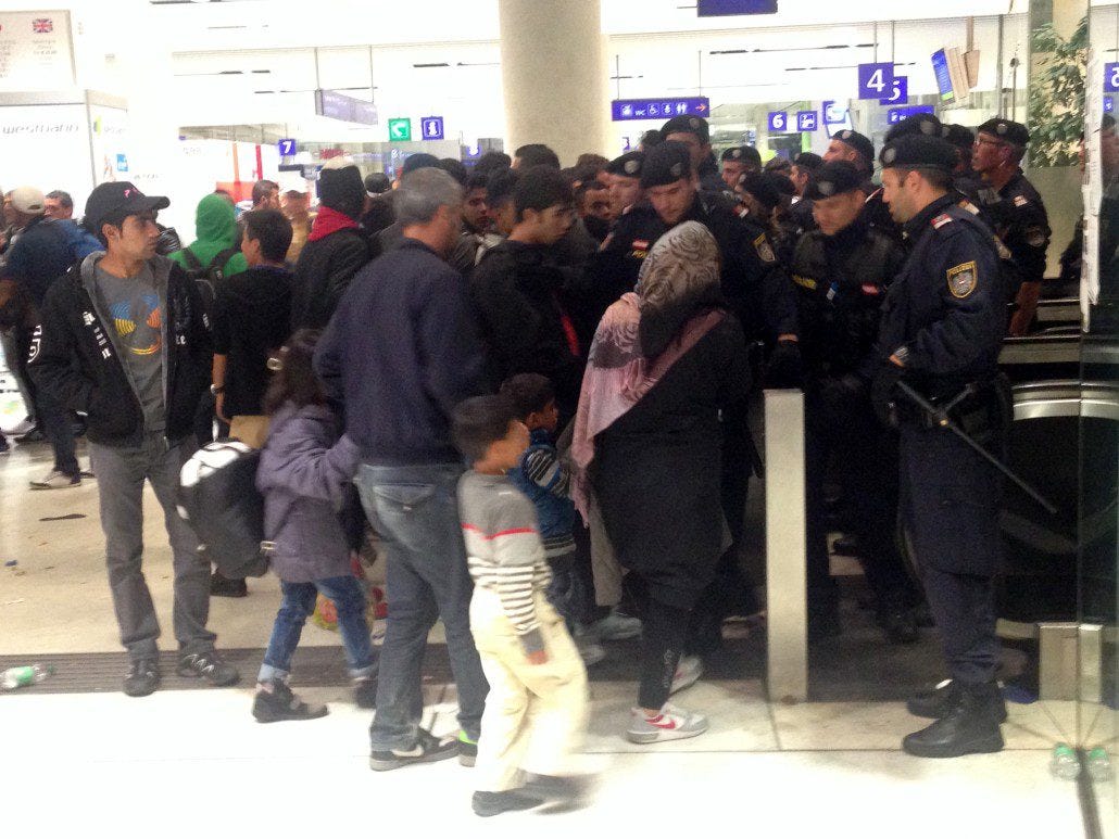 Police block the entrance to the train platforms.