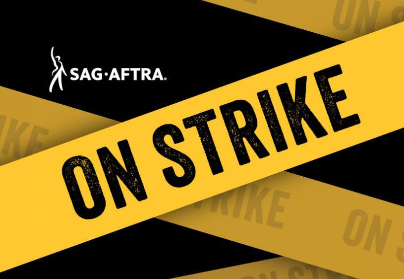 Graphic of yellow tape that reads SAG-AFTRA ON STRIKE