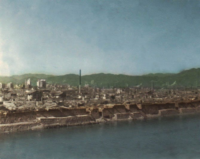 https://upload.wikimedia.org/wikipedia/commons/7/7b/Hiroshima_after_the_Atom_Bomb_Strike_1945_taken_by_sailors_of_USS_Tuscaloosa_-_Clean_and_Colored.jpg