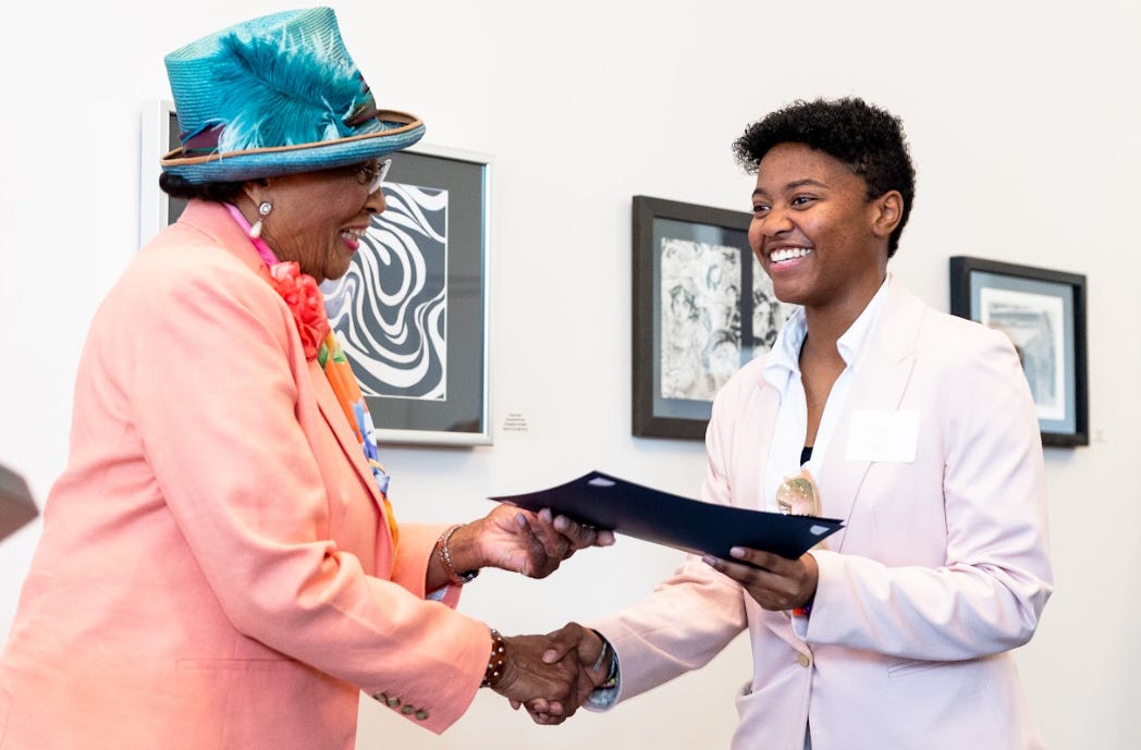 Congresswoman Adams presents a certificate to Melody Saxton at the Bechtler Museum of Modern Art, May 21, 2023 (Photo by Ghost Crab Productions LLC)